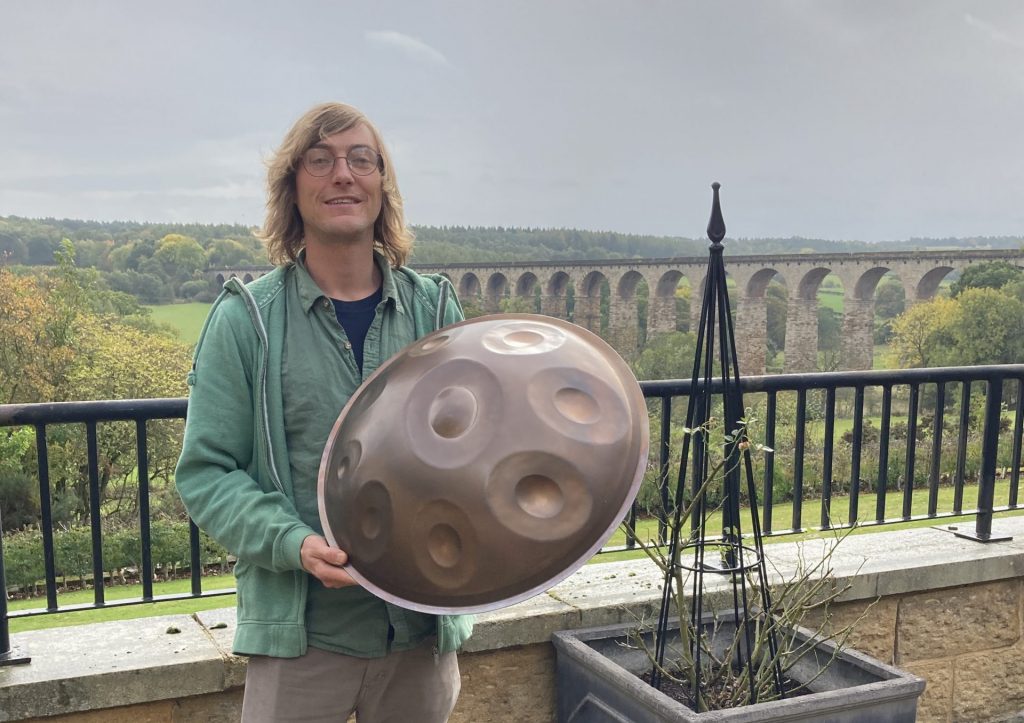 Joe Jordan, from Rural Arts, holding a Handpan which was played at our Share & Support group
