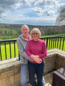 Graham and Susan together in front of the Crimple viaduct on a sunny day